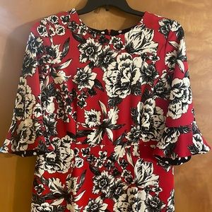 Red dress with black and white flowers.